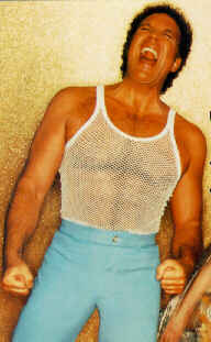 Tom Jones in a crazy fishnet shirt!